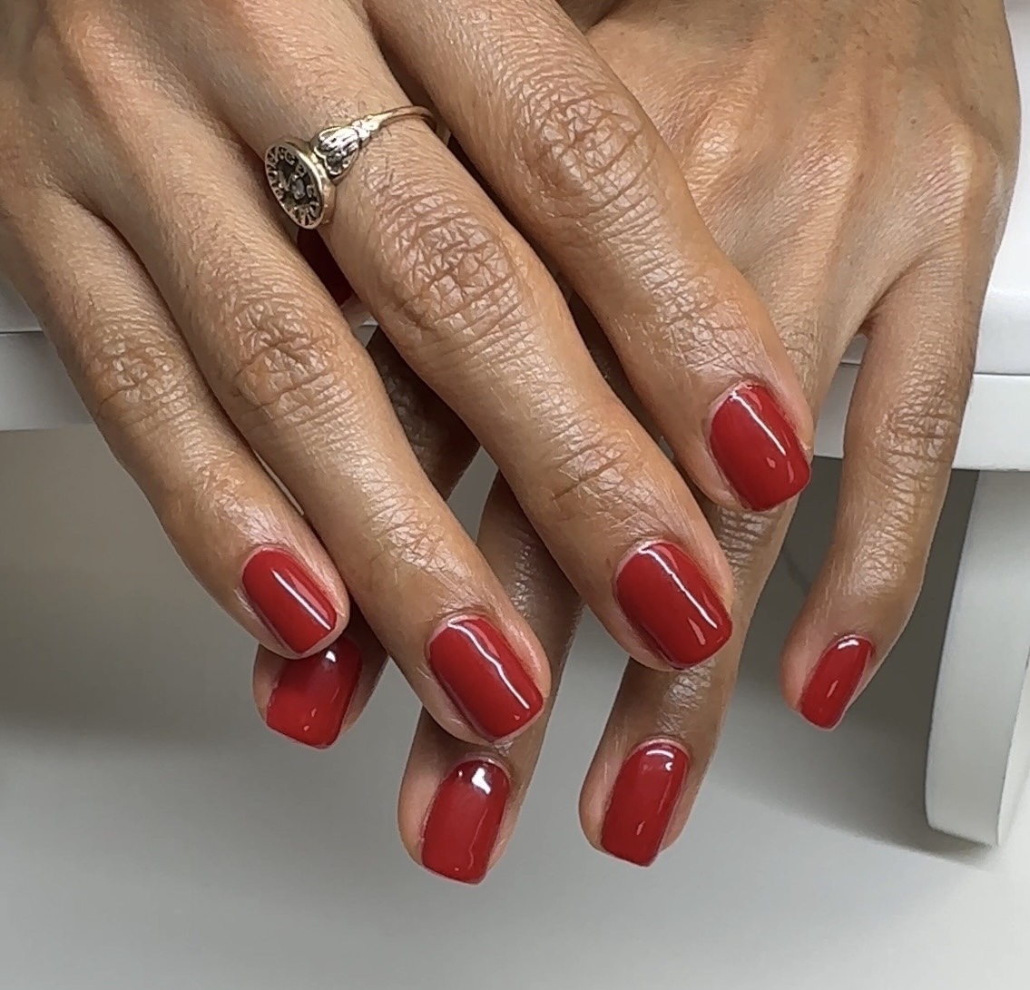 Gel manicure with red polish